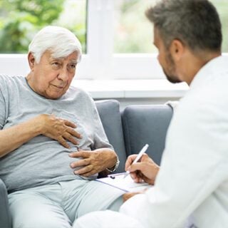 A mesothelioma patient talks to their oncologist about treatment side effects that are making it difficult to eat.